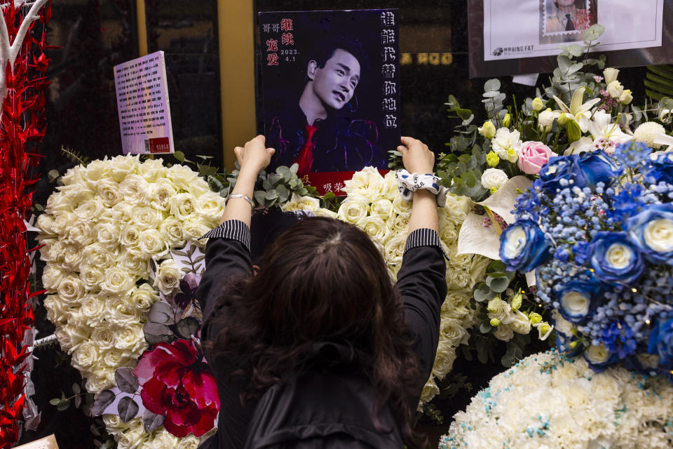 A fan visits outside the Mandarin Oriental Hotel to commemorate the 20th anniversary of the passing of Canto-pop singer and actor Leslie Cheung in Hong Kong, Saturday, April 1, 2023. (AP Photo/Louise Delmotte)