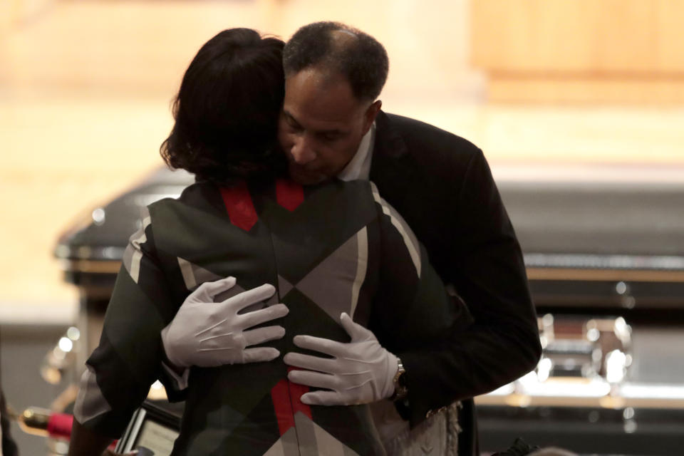 Emmanuel Stanley, grand master of Most Worshipful Prince Hall Grand Lodge of Maryland, right, hugs Maya Rockeymoore, widow of U.S. Rep. Elijah Cummings, during a viewing service at Morgan State University, Wednesday, Oct. 23, 2019, in Baltimore. The Maryland congressman and civil rights champion died Thursday, Oct. 17, at age 68 of complications from long-standing health issues. (AP Photo/Julio Cortez)