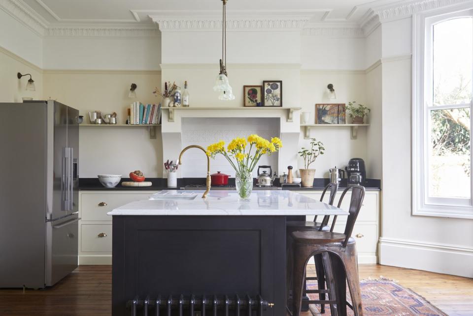 <p>If your fitted kitchen units can only go along one wall, a brilliant way to gain more space (both for <a href="https://www.goodhousekeeping.com/uk/house-and-home/declutter-your-home/g38576530/storage-jars/" rel="nofollow noopener" target="_blank" data-ylk="slk:storage;elm:context_link;itc:0;sec:content-canvas" class="link ">storage</a> and worktop use), is to fit a kitchen island with cupboards and shelving – if your room and budget allows. If it doesn’t, you can get the same benefit via a large dining table, which will give you more room to prepare meals and entertain. A mobile kitchen island on wheels can also be a good option, especially as they are more affordable.</p>