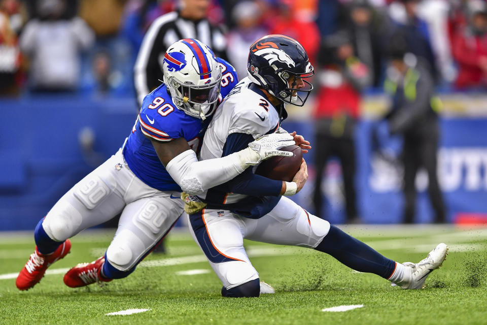 Buffalo Bills defensive end Shaq Lawson (90) sacks Denver Broncos quarterback Brandon Allen (2) during the fourth quarter of an NFL football game, Sunday, Nov. 24, 2019, in Orchard Park, N.Y. (AP Photo/Adrian Kraus)