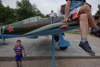 Children play on a Soviet-style military airplane at Kremlin in Nizhny Novgorod, Russia, June 30, 2018. REUTERS/Damir Sagolj