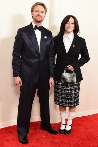 <p>Gregg DeGuire/WWD via Getty</p> Finneas and Billie Eilish at the Oscars on March 10, 2024 in Los Angeles