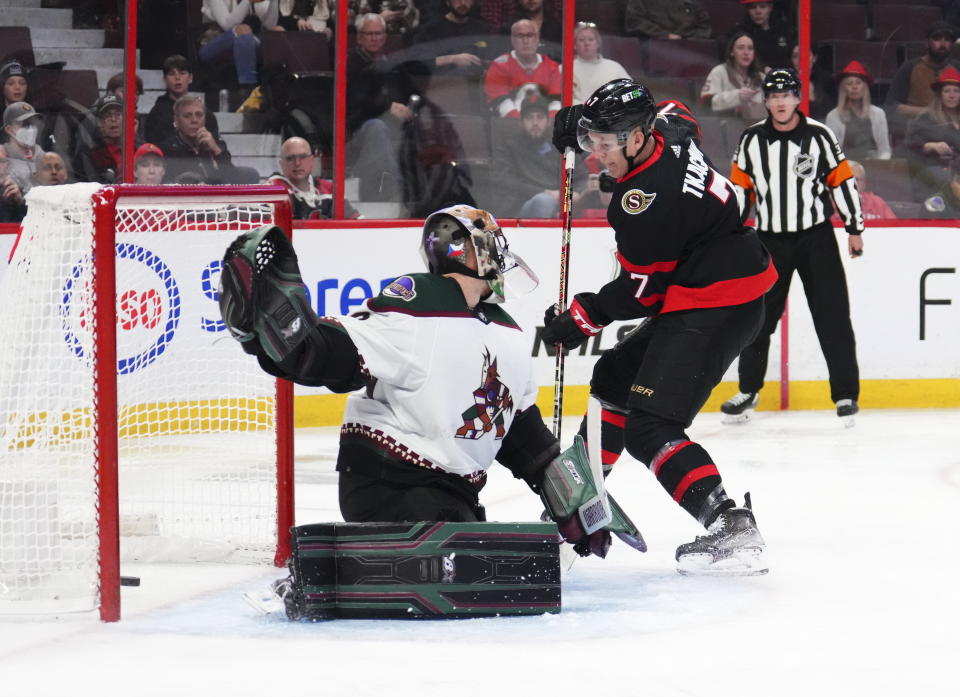 Ottawa Senators left wing Brady Tkachuk (7) scores on Arizona Coyotes goaltender Karel Vejmelka (70) during the second period of an NHL hockey game in Ottawa, Ontario on Saturday, Oct. 22, 2022. (Sean Kilpatrick/The Canadian Press via AP)