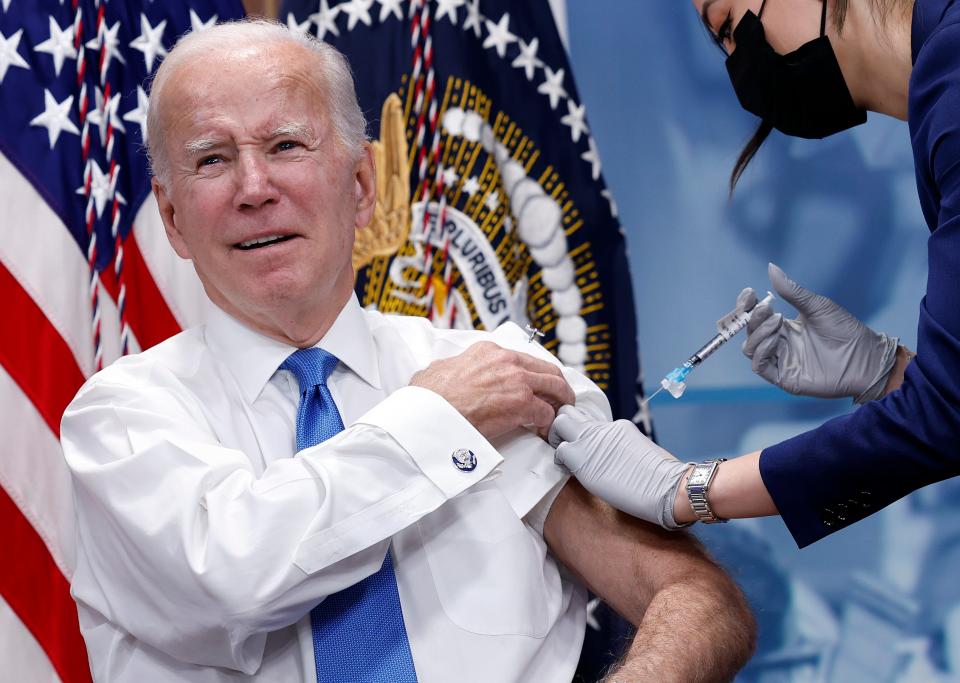 President Joe Biden receives his updated COVID-19 booster in the South Court Auditorium at the White House campus on October 25, 2022 in Washington, DC.