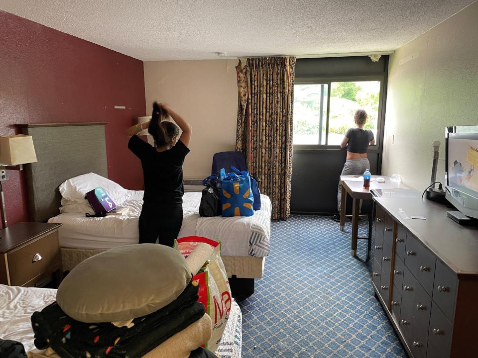 A woman and her daughter get ready to vacate their room at the Motel 6 in Rochester July 31, 2023, after the Monroe County Dept. of Human Services said it would no longer make emergency housing placements there.