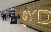 Passengers prepare at Sydney Airport to catch flights in Sydney, Australia, Monday, April 19, 2021, to New Zealand as the much-anticipated travel bubble between Australia and New Zealand opens. (AP Photo/Rick Rycroft)