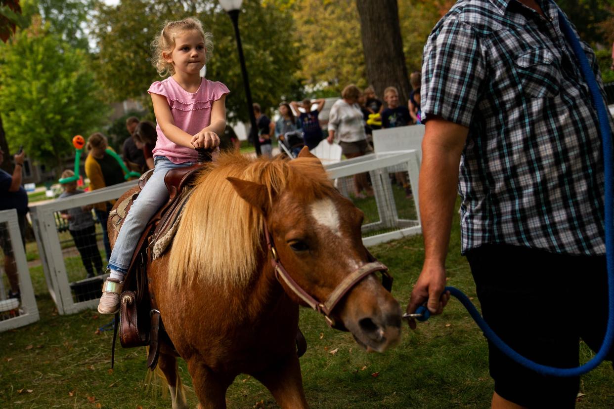 Everly Gebben, 5, rides a pony during Zeeland's Pumpkinfest on Saturday, Oct. 2, 2021.