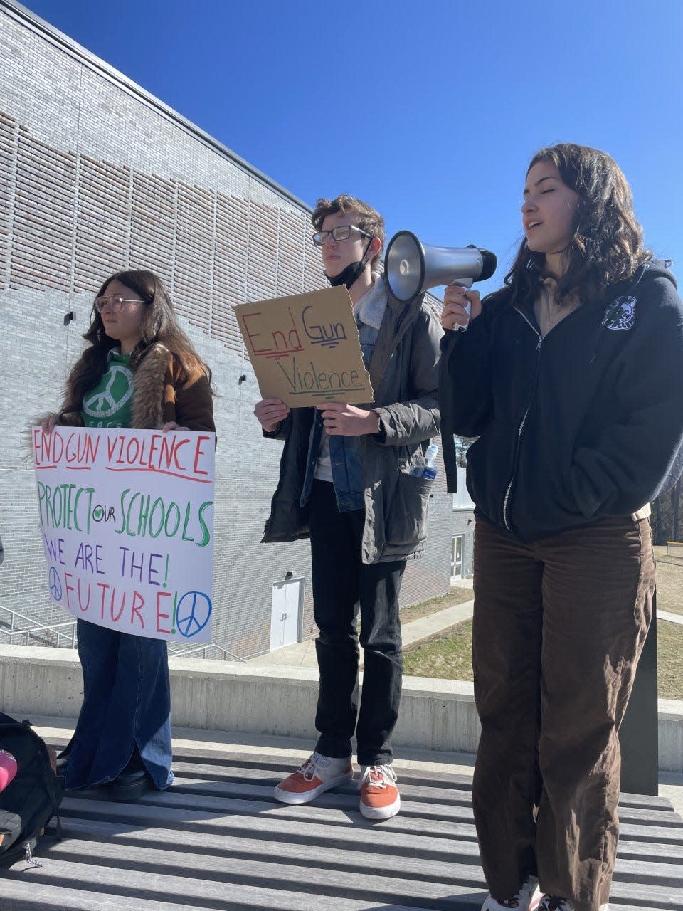 Dover High School students held a walkout in protest of gun violence on Thursday, March 30, 2023 following a deadly school shooting in Nashville, Tennessee on Monday, March 27. From left are Dover High School seniors Isabella Papa, Logan Lampel and Charlotte Albert.