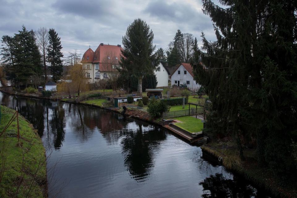 A canal and houses in the sleepy community of Grünheide.