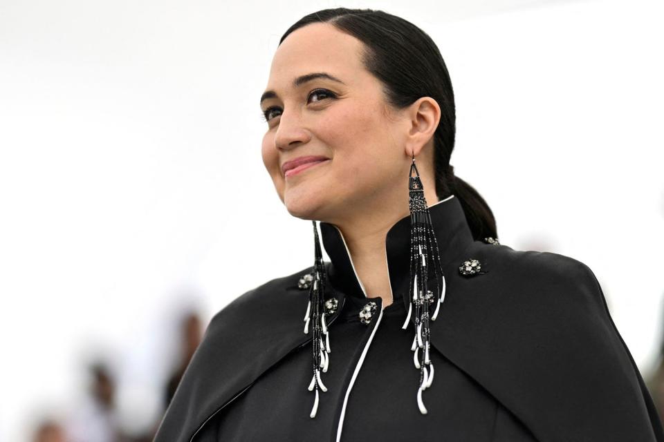 <p>PATRICIA DE MELO MOREIRA/AFP via Getty</p> Lily Gladstone poses during a photocall for the film "Killers of the Flower Moon" at the 76th edition of the Cannes Film Festival