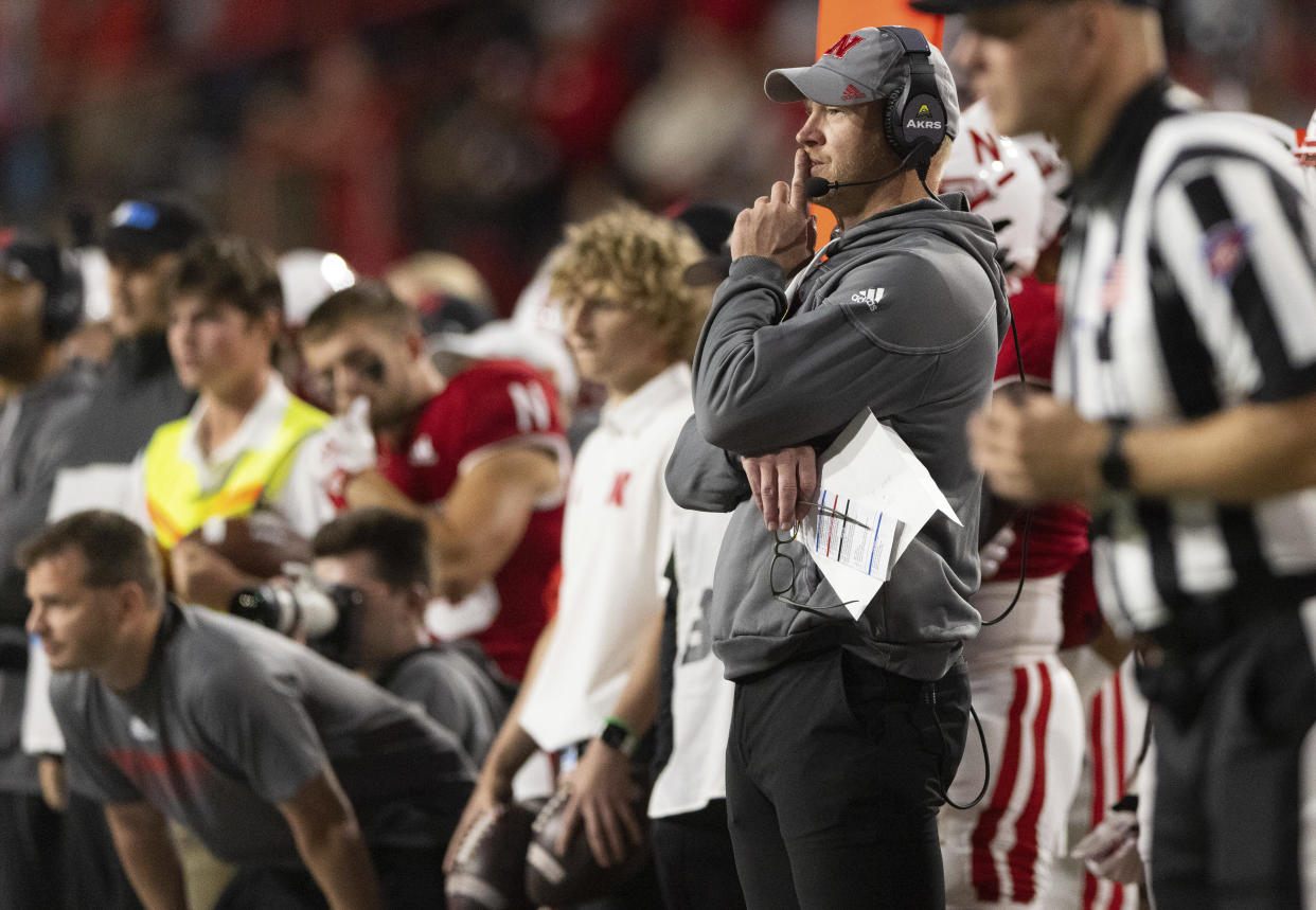 Nebraska head coach Scott Frost, second from right, watches from the sideline as his team plays against Georgia Southern during the second half of an NCAA college football game Saturday, Sept. 10, 2022, in Lincoln, Neb. (AP Photo/Rebecca S. Gratz)