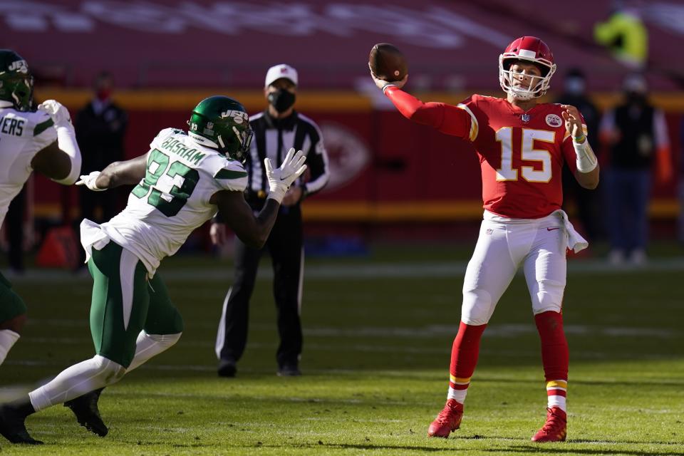 New York Jets linebacker Tarell Basham (93) pressures as Kansas City Chiefs quarterback Patrick Mahomes (15) throws a pass in the second half of an NFL football game on Sunday, Nov. 1, 2020, in Kansas City, Mo. (AP Photo/Jeff Roberson)