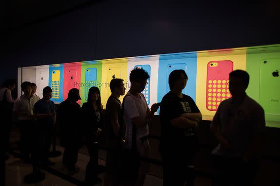 Customers line up outside the Apple store in Hong Kong's Central district in 2013 to buy the  iPhone 5s .