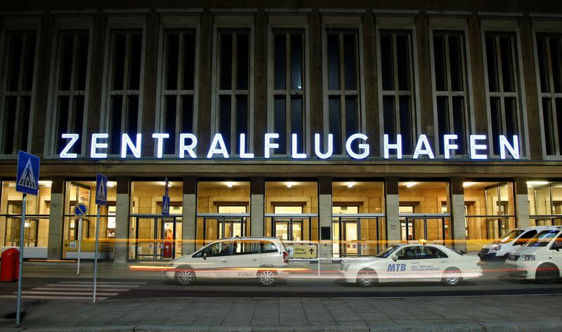 FILE PHOTO: A taxi drives in front of the main hall at Berlin's Tempelhof airport