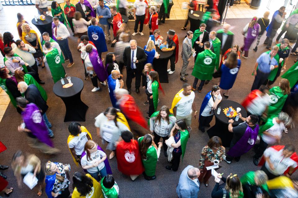 Attendees gather before the start of the United Way of Lee, Hendry and Glades 2023-24 Campaign Kickoff at the Barbara B. Mann Performing Arts Hall in Fort Myers on Wednesday, Nov. 8, 2023.