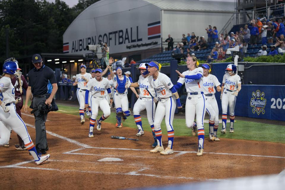 May 10, 2024; Auburn, AL, USA; The Florida Gators cheer for teammate Mia Williams (11) after her home run against the Texas A&M Aggies at Jane B. Moore Field. Mandatory Credit: Julie Bennett-USA TODAY Sports