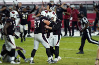 Arizona Cardinals kicker Zane Gonzalez, right, celebrates his game winning field goal with offensive guard Justin Pugh (67)during the second half of an NFL football game against the Seattle Seahawks, Sunday, Oct. 25, 2020, in Glendale, Ariz. The Cardinals won 37-34 in overtime. (AP Photo/Rick Scuteri)