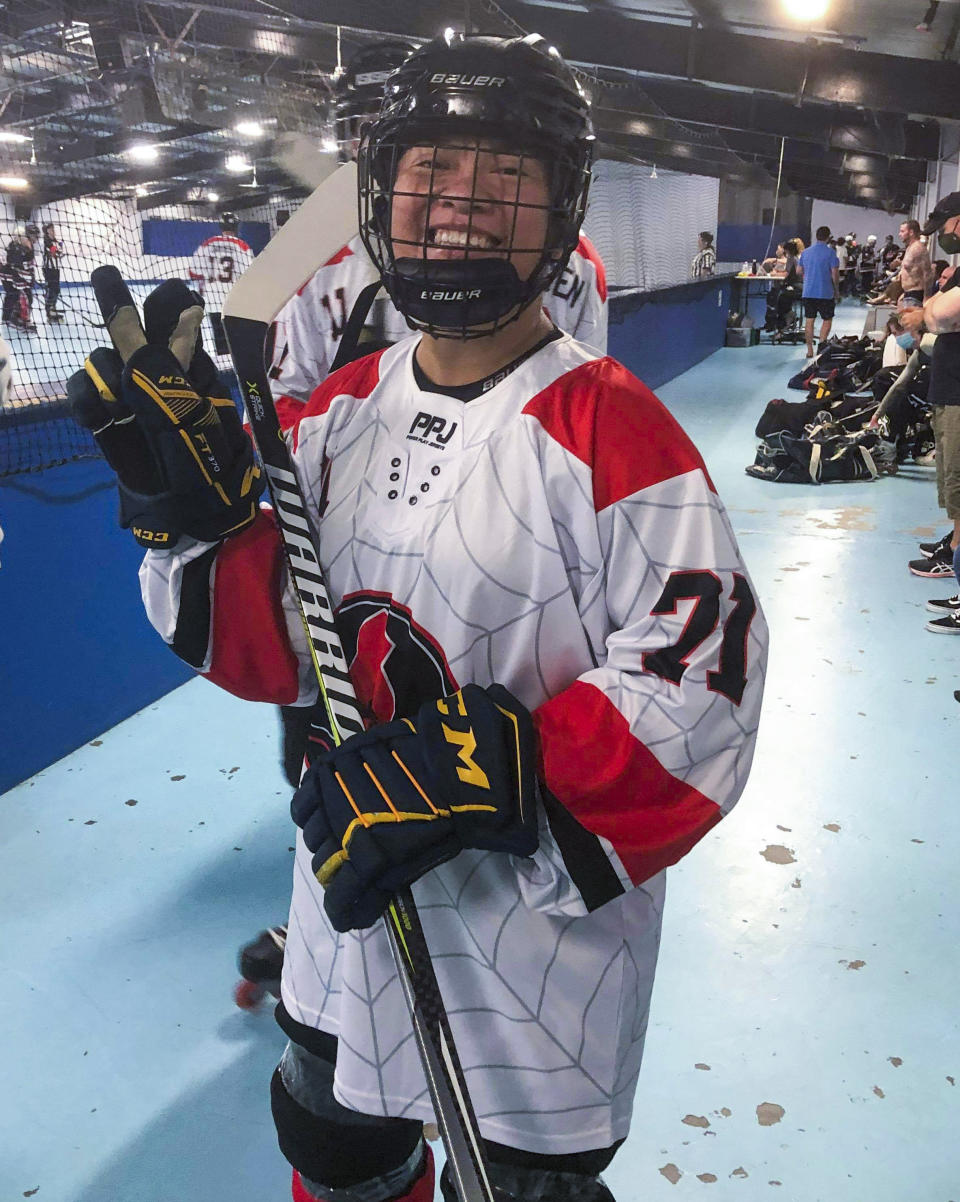 In this photo provided by Nick Gray, Vivienne Gray poses for a photo prior to a game of inline hockey in Brisbane, Australia, April 2, 2021. Gray doesn't fit the same profile as former or current professional athletes forced to live with the ongoing effects of concussions. The 33-year-old cardiac care nurse has been fighting the side effects of a concussion following a collision with an opposing player during an inline hockey game nearly two years ago. (Nick Gray via AP)