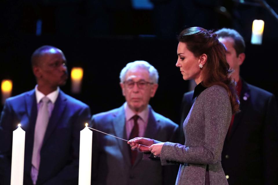 The Duchess of Cambridge lights a candle during the UK Holocaust Memorial Day Commemorative Ceremony (PA)