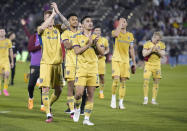 Real Salt Lake midfielder Pablo Ruiz, front, leads teammates to acknowledge the team's fans after the second half of an MLS soccer match against the Colorado Rapids Saturday, May 20, 2023, in Commerce City, Colo. (AP Photo/David Zalubowski)