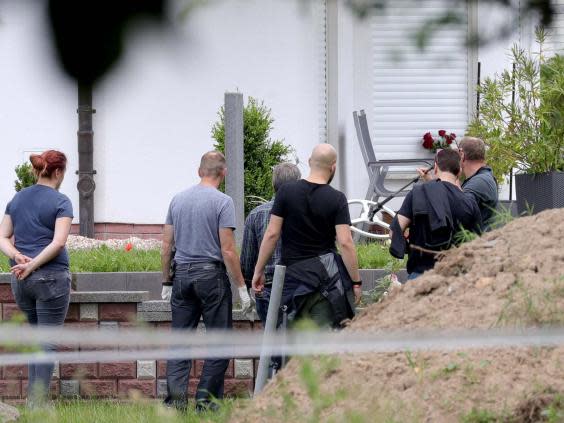 Police search the grounds of Walter Luebcke's home in Kassel (EPA)