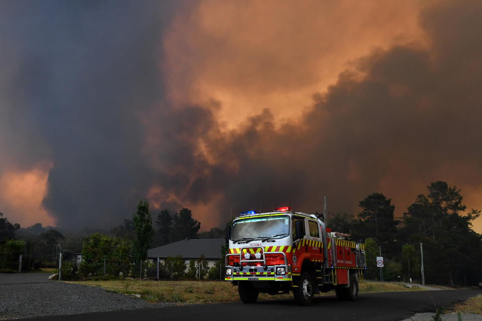 RFS crews prepare for the Green Wattle Creek Fire as it threatens homes in Yandeera in the south west of Sydney, Saturday, December 21, 2019. Source: AAP Image/Dean Lewins