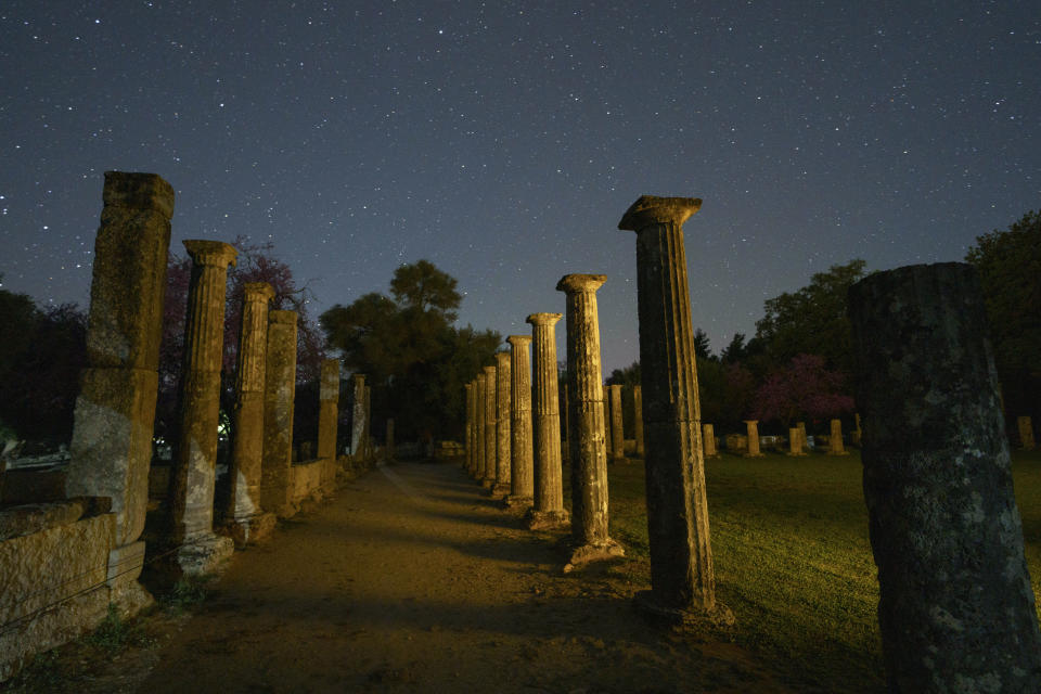 The 3rd century B.C. Palaestra, a place that wrestlers and athletes were training, is seen under the stars at the birthplace of the Olympic Games early Tuesday, April 9, 2024 in a night-time image made following special permission by the Culture Ministry. The ancient Olympic Games began in 776 BC. Baron Pierre de Coubertin inspired by the ancient games and his wish to invigorate a contemporary sports culture, led to the inaugural modern Games being staged in Athens in 1896.(AP Photo/Petros Giannakouris)