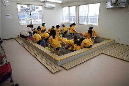 Children play at an indoor sand pit of the Emporium kindergarten in Koriyama, west of the tsunami-crippled Fukushima Daiichi nuclear power plant, Fukushima prefecture February 28, 2014. REUTERS/Toru Hanai
