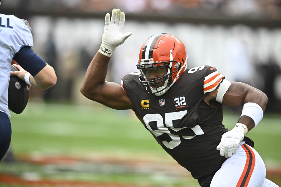 Cleveland Browns defensive end Myles Garrett (95) pressures Tennessee Titans quarterback Ryan Tannehill, left, during the first half of an NFL football game Sunday, Sept. 24, 2023, in Cleveland. (AP Photo/David Richard)