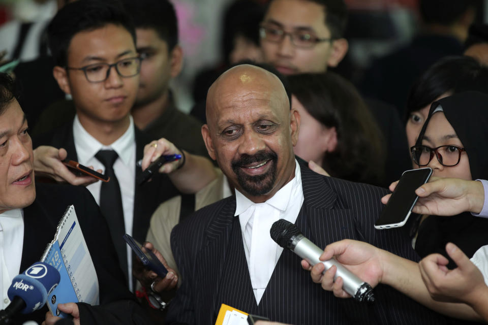 Naran Singh, center, lawyer for Vietnamese Doan Thi Huong, center, speaks during a press conference after a court hearing at Shah Alam High Court in Shah Alam, Malaysia, Thursday, Aug. 16, 2018. Malaysian court has ordered Indonesia's Siti Aisyah and Vietnam's Doan Thi Huong, to enter their defense over the murder of north Korean leader's half brother in a brazen assassination that has gripped the world. (AP Photo/Jeffrey Ong)