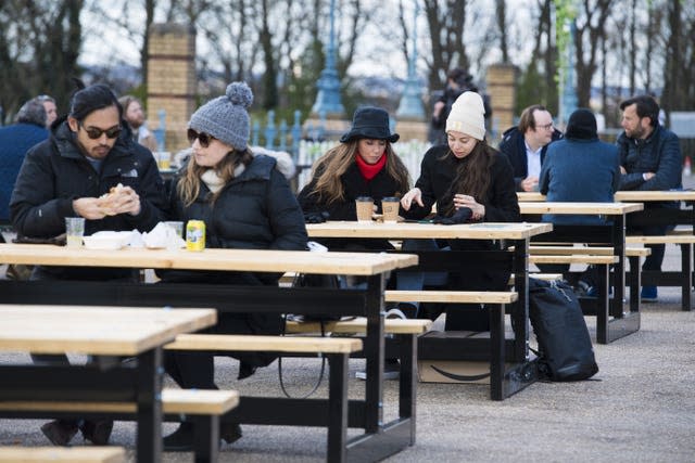 Customers enjoy a drink at the reopening of the Terrace Bar at Alexandra Palace, London (Kirsty O'Connor/PA)