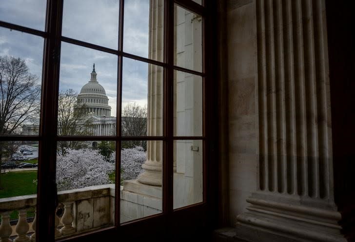 The U.S. Capitol is seen through a window in the Russell Senate office building in Washington