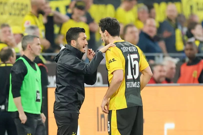 Assistant coach Nuri Sahin of Borussia Dortmund and Mats Hummels of Borussia Dortmund talk together during the Bundesliga match between Borussia Dortmund and VfB Stuttgart at Signal Iduna Park on April 6, 2024 in Dortmund, Germany.