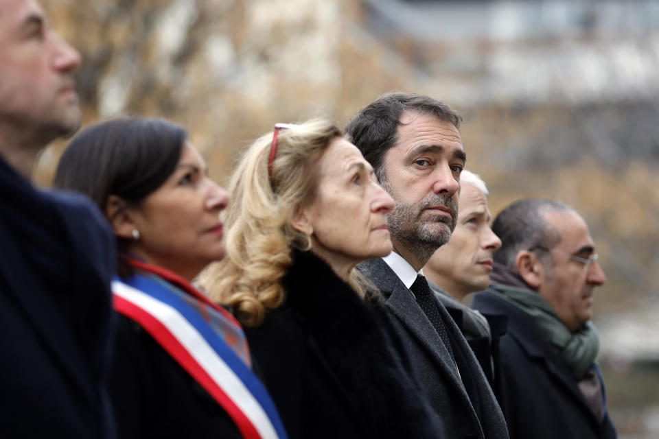 Paris Mayor Anne Hidalgo, left, French Interior Minister Christophe Castaner, center right, Justice Minister Nicole Belloubet, center, French culture minister Franck Riester and Junior Interior Minister Laurent Nunez, right, attend a ceremony to mark the fourth anniversary of the attack in Paris, Monday, Jan. 7, 2019. Cartoonists, religious leaders and top French officials are paying respects to 17 people killed by Islamic extremists targeting satirical newspaper Charlie Hebdo and a kosher supermarket in 2015. (Gonzalo Fuentes, Pool via AP)