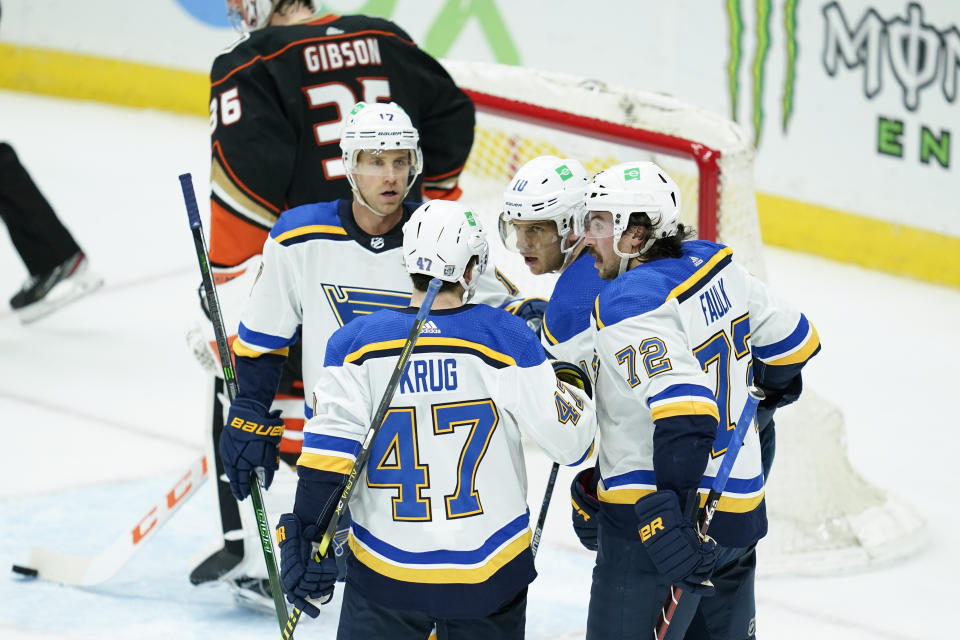 St. Louis Blues players react after a goal by center Brayden Schenn, second from right, during the second period of an NHL hockey game against the Anaheim Ducks, Sunday, Jan. 31, 2021, in Anaheim, Calif. (AP Photo/Ashley Landis)