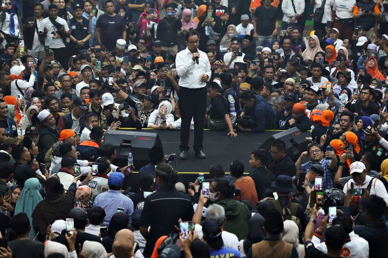 Former Jakarta Governor and presidential candidate Anies Baswedan speaks during his campaign at a sports hall in Tasikmalaya
