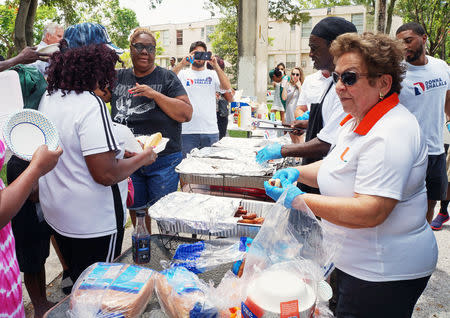 Donna Shalala, a Democrat running for Congress, speaks with voters at a campaign barbecue in South Miami, Florida, U.S., on July 7, 2018. REUTERS/Letitia Stein