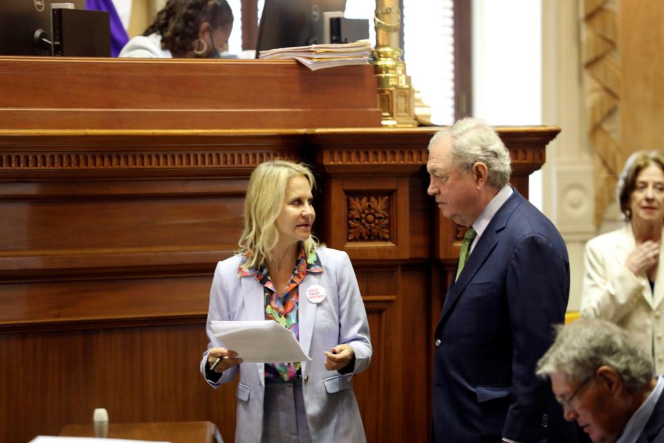 South Carolina Sen. Sandy Senn, R-Charleston, left, talks to Sen. Dick Harpootlian, D-Columbia, right, before the Senate begins debating a stricter law on abortion on Tuesday, May, 23, 2023, in Columbia, S.C. (AP Photo/Jeffrey Collins)