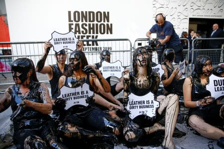 Activists from PETA stage a demonstration outside a venue during London Fashion Week in London