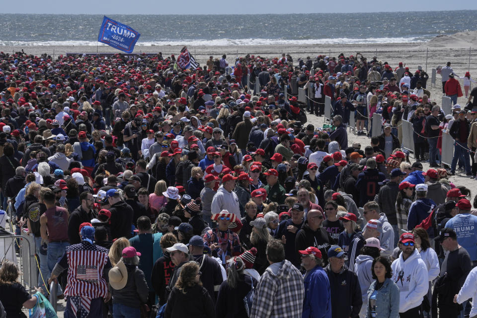 People wait in line to enter a campaign rally for Republican presidential candidate former President Donald Trump in Wildwood, N.J., Saturday, May 11, 2024. (AP Photo/Matt Rourke)