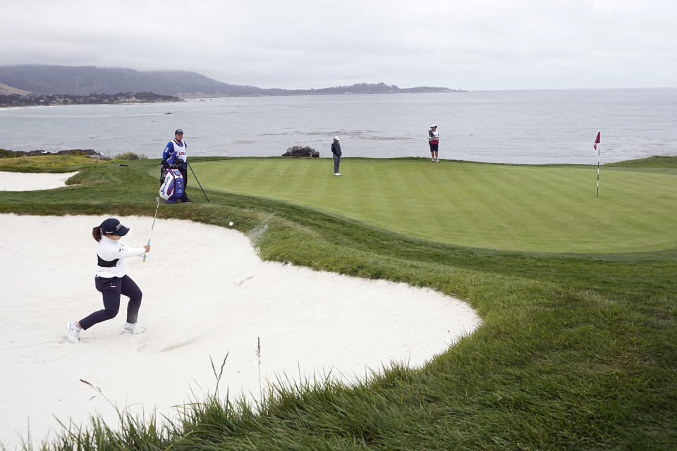 Nasa Hataoka, of Japan, hits from a bunker to the eighth green during the second round of the U.S. Women's Open golf tournament at the Pebble Beach Golf Links, Friday, July 7, 2023, in Pebble Beach, Calif. (AP Photo/Darron Cummings)