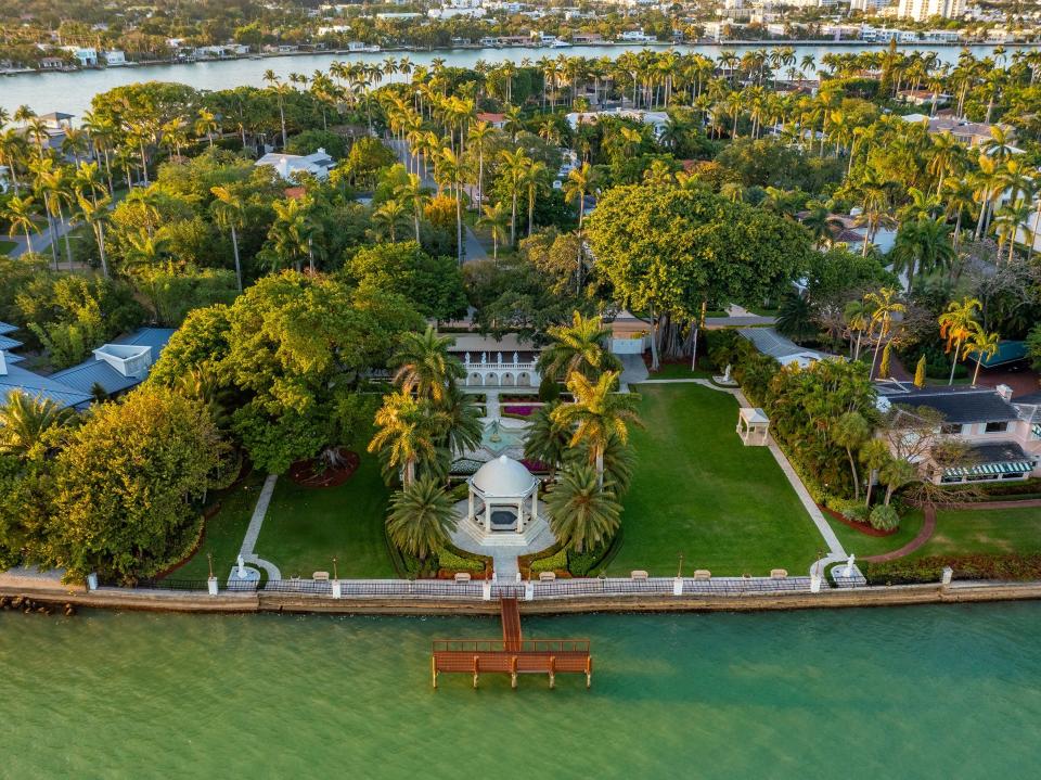 a waterfront property surrounded by lush green trees in Florida