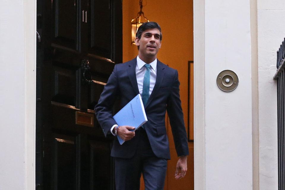 <p>Rishi Sunak leaves 11 Downing Street, London, ahead of delivering his one-year Spending Review</p> (PA)