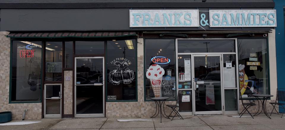 Dustin Polage and Samuel Smith, owners of Franks and Sammies, opened Tap That Glass taproom on Friday next to their existing business on South Third Street in Newark.