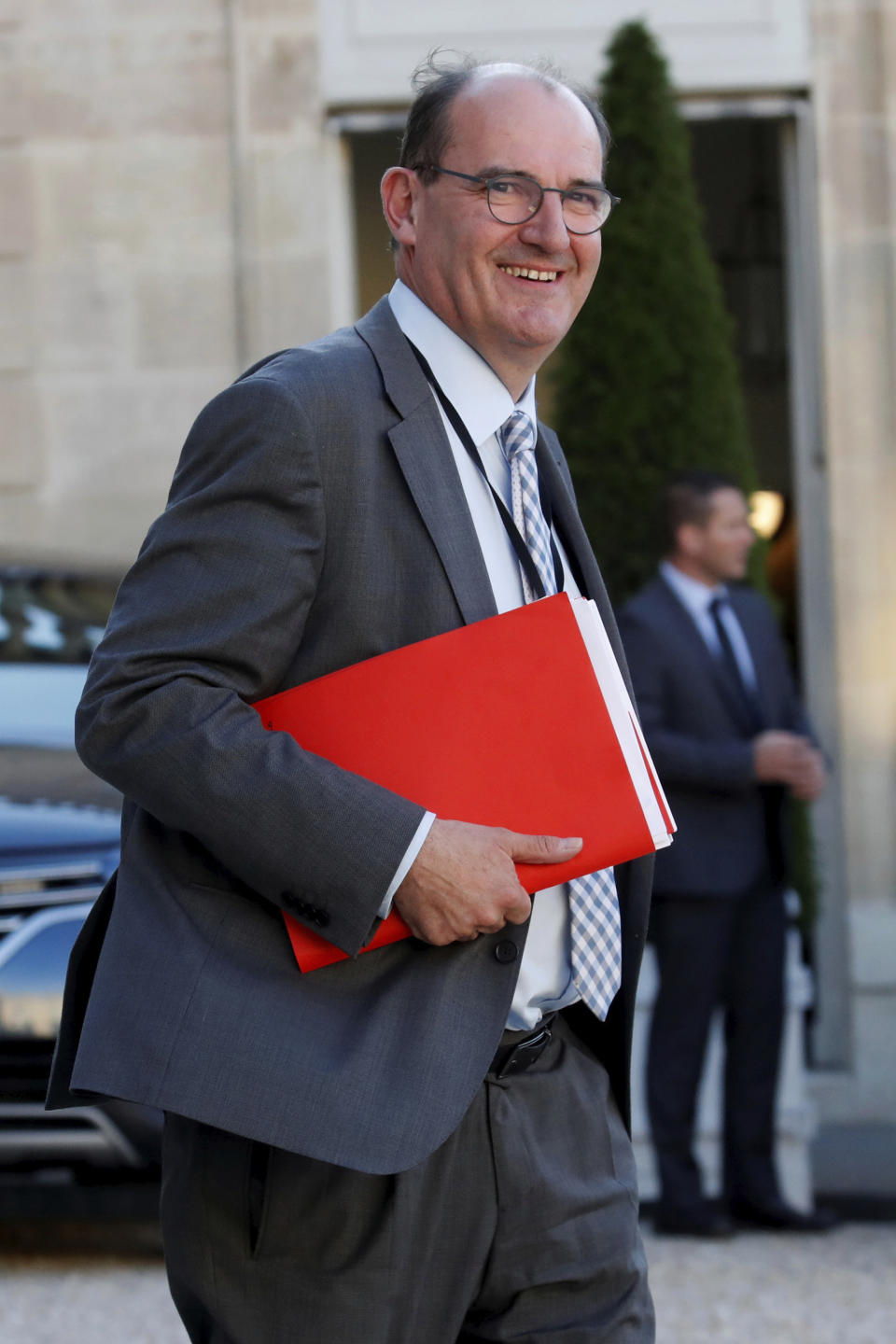 FILE - In this May 19, 2020 file photo, Jean Castex leaves after a videoconference with the French President and French mayors at the Elysee Palace in Paris. French President Emmanuel Macron has named Jean Castex, who coordinated France's virus reopening strategy, as new prime minister on Friday July 3, 2020. Emmanuel Macron is reshuffling the government to focus on reviving the economy after months of lockdown. (Gonzalo Fuentes/Pool via AP, File)