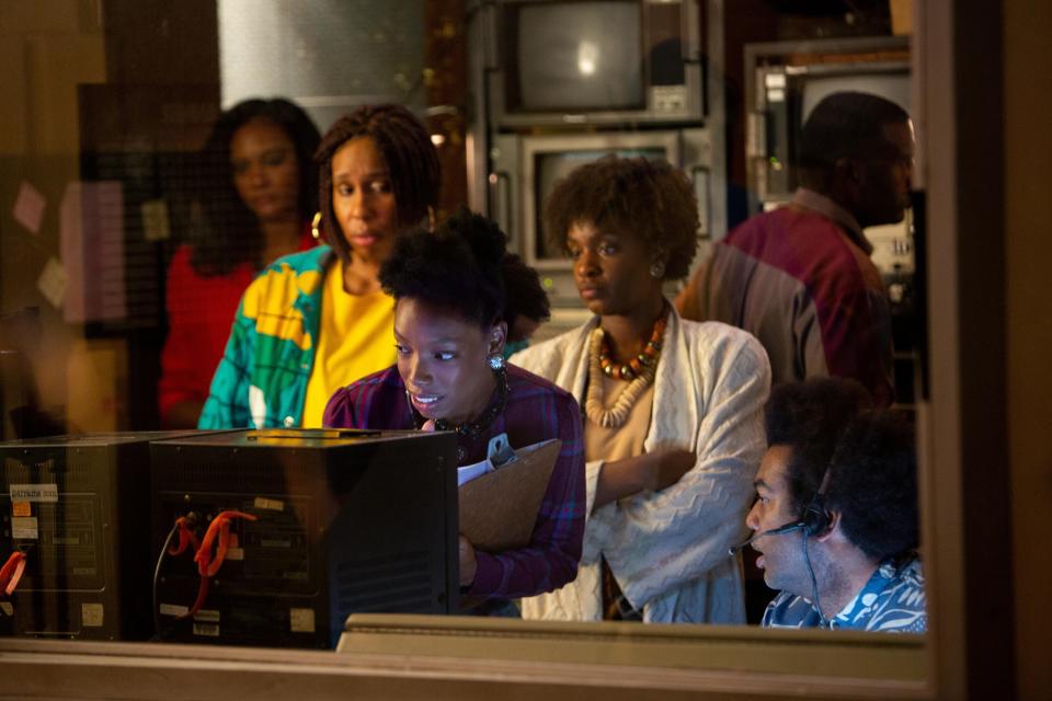 Anna's (Elle Lorraine, center) new boss fixates on Anna's natural hair and lets it be known that "sisters get fired for less than that every day."