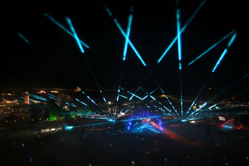 Revellers dance at Arcadia at Worthy Farm in Somerset during the Glastonbury Festival