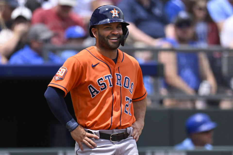 Houston Astros' Jose Altuve smiles after stealing third base during the third inning of a baseball game against the Kansas City Royals, Sunday, June 5, 2022, in Kansas City, Mo. (AP Photo/Reed Hoffmann)