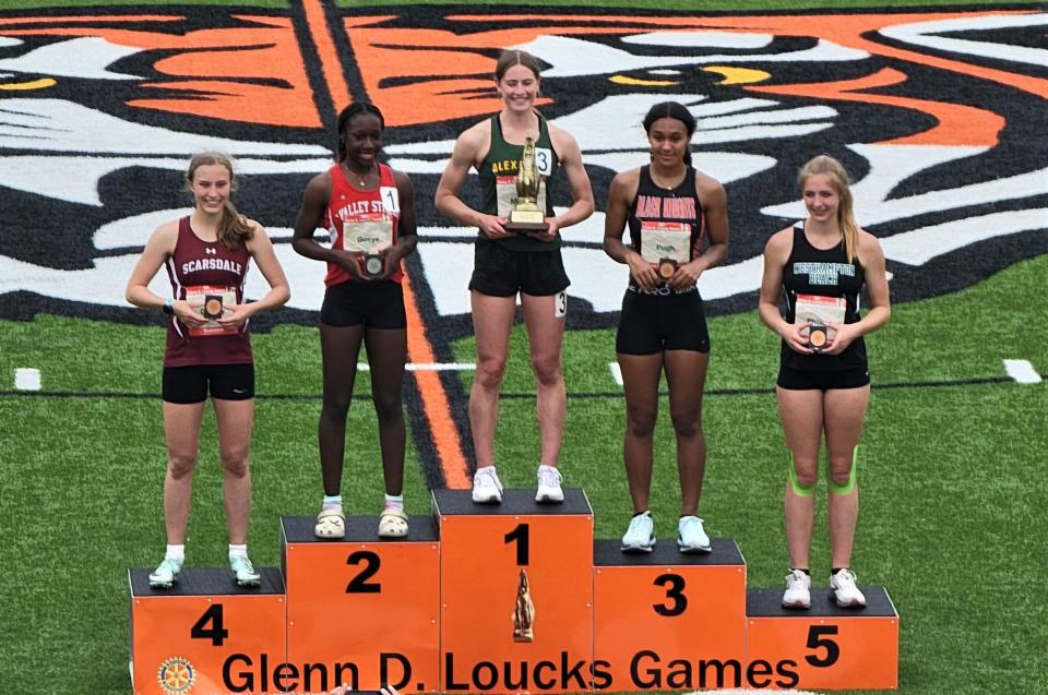 Rome Free Academy's Imani Pugh (third place) poses with other top finishers in the outdoor pentathlon at the 55th annual Glenn D. Loucks Games in White Plains.