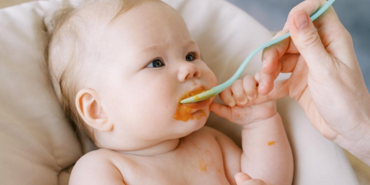 spoon feeding a baby won't eat solids